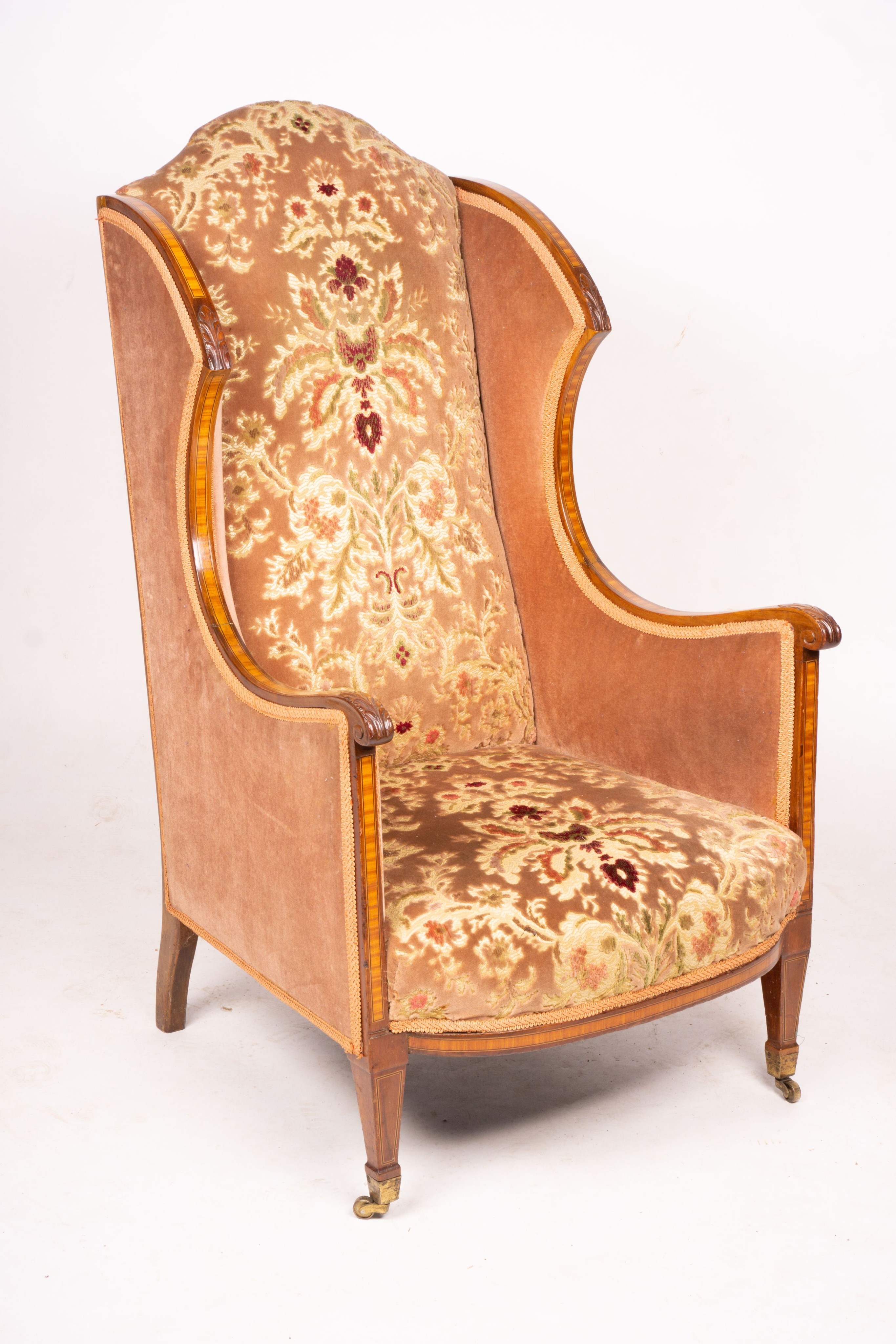 A pair of Edwardian satinwood banded mahogany wing armchairs, width 56cm, depth 75cm, height 110cm